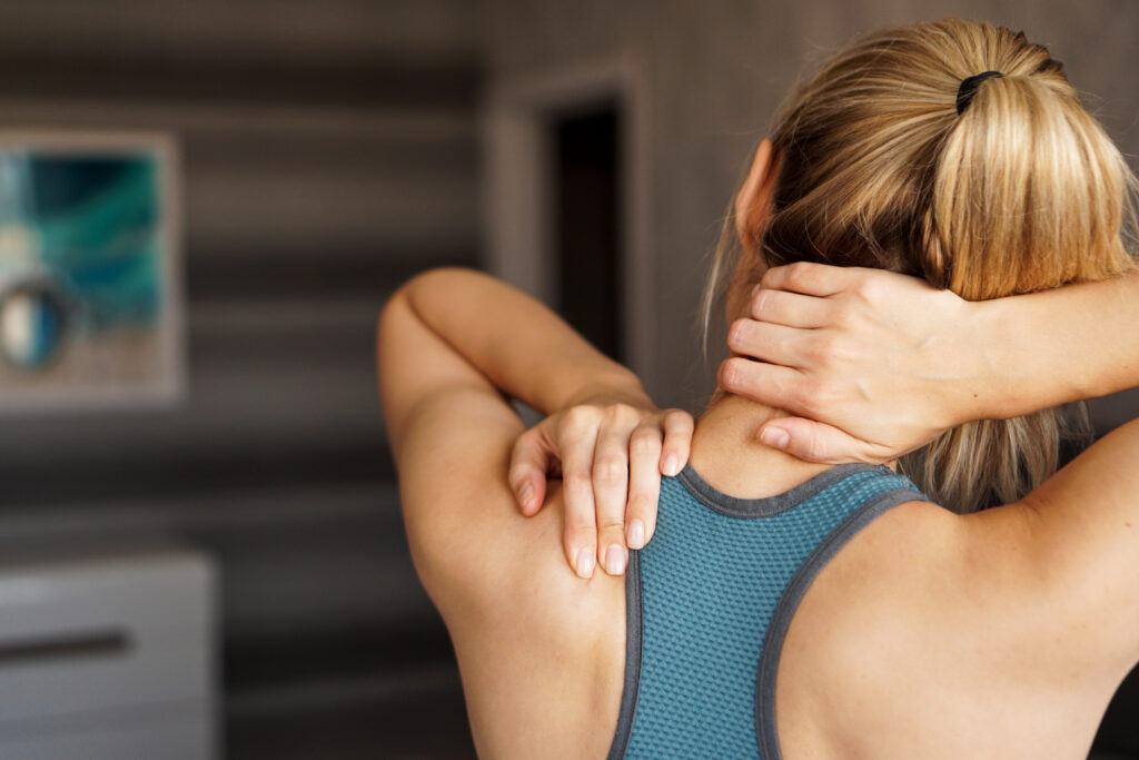 Photo of woman with joint pain in her neck