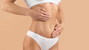 Photo of woman holding onto her stomach